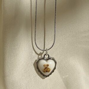 Silver Heart Pendant Necklace with Teddy Bear Design